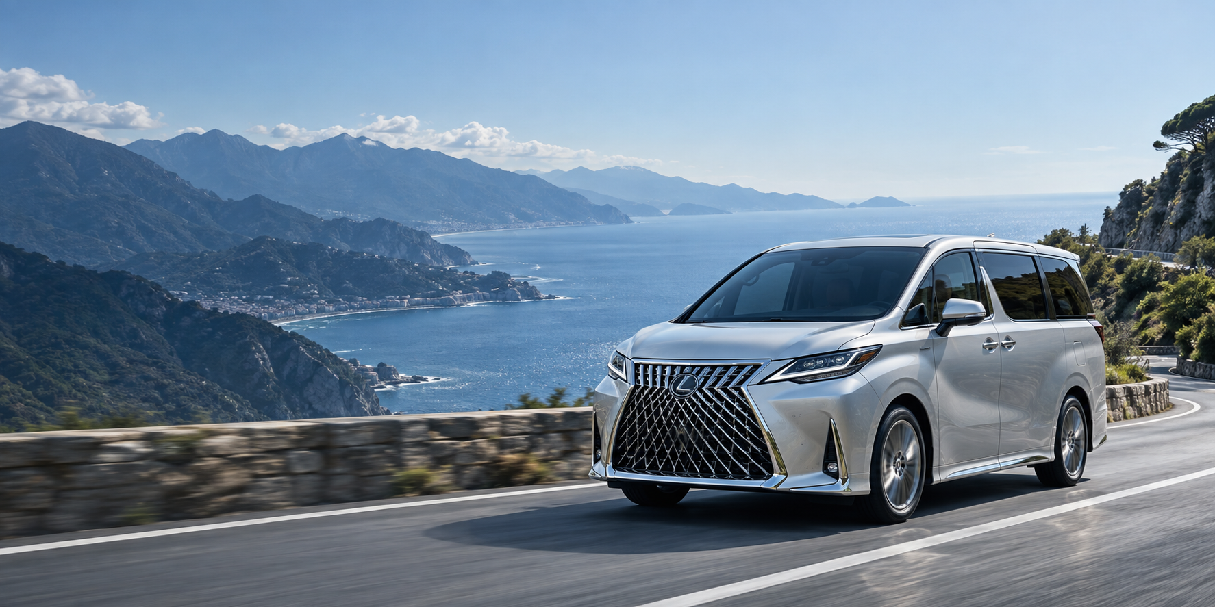 Silver luxury vehicle on a coastal road